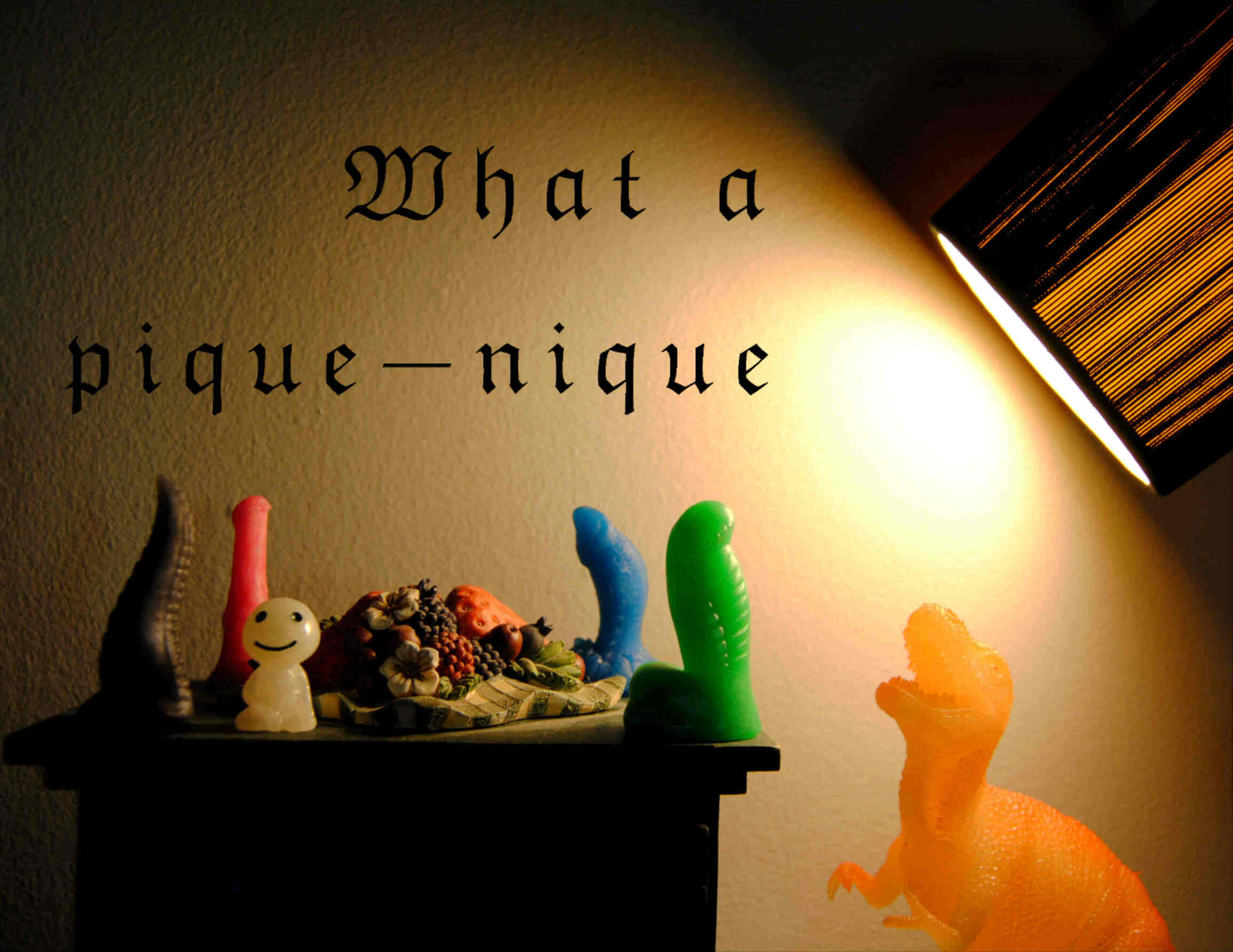picture of mini dildos and a plastic dinosaur, it is written : What a pique nique